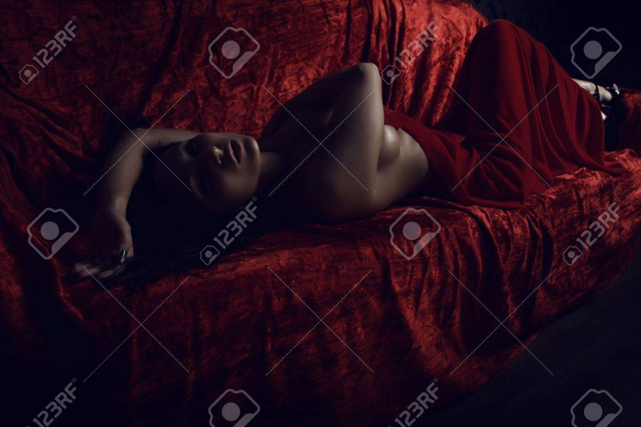 very sexy woman covered with red silk sheet stock photo picture and red silk sheet
