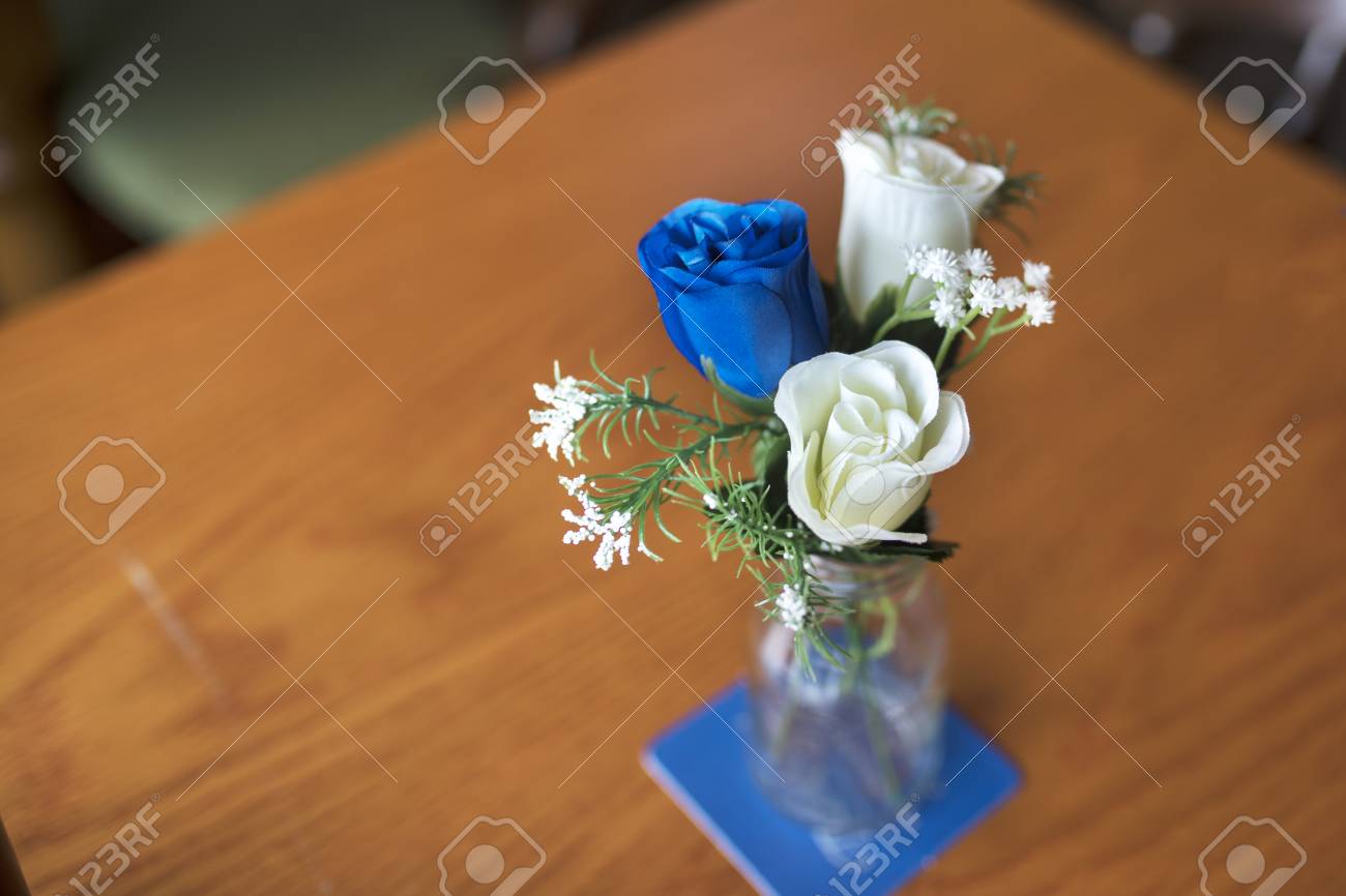 Close Up Of Blue And White Artificial Roses As A Table Decoration