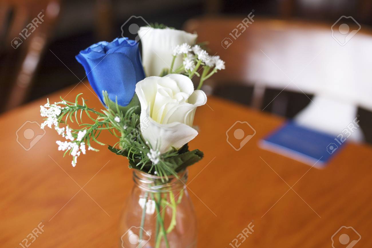 Close Up Of Atrificial Blue And White Roses As A Table Decoration