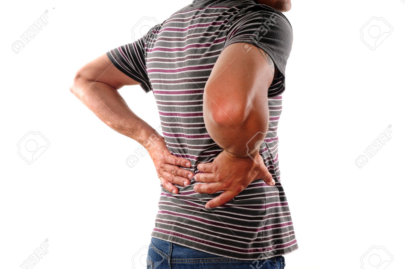 Man Holding Back Who Is Suffering From Lower Back Pain Stock Photo, Picture And Royalty Free Image. Image 13861786.