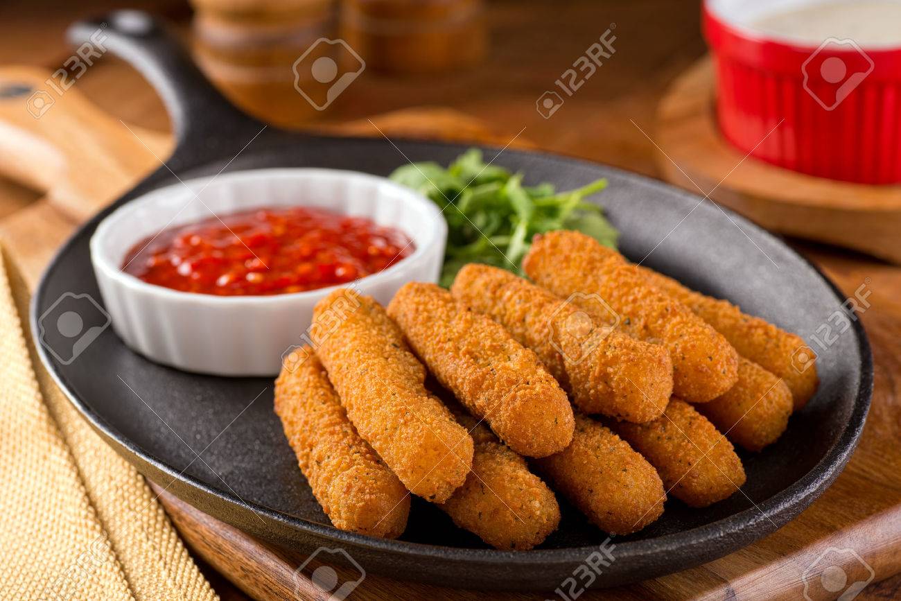 delicious breaded mozzarella cheese sticks with marinara dipping