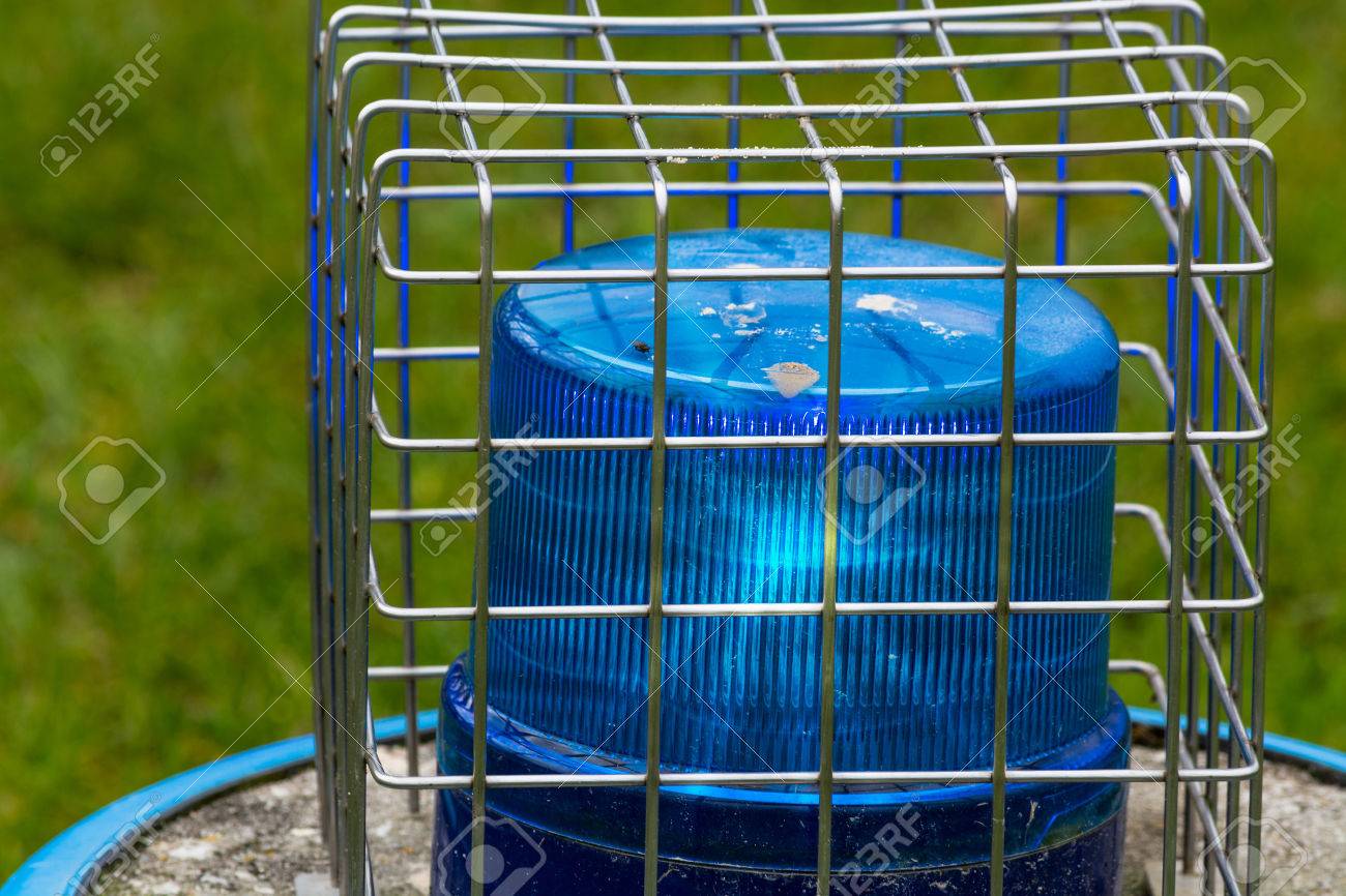 Blue flashing light, police siren against destruction with wire sheathed. - 61226615 Blue flashing light, police siren against destruction with wire sheathed. - 61226615