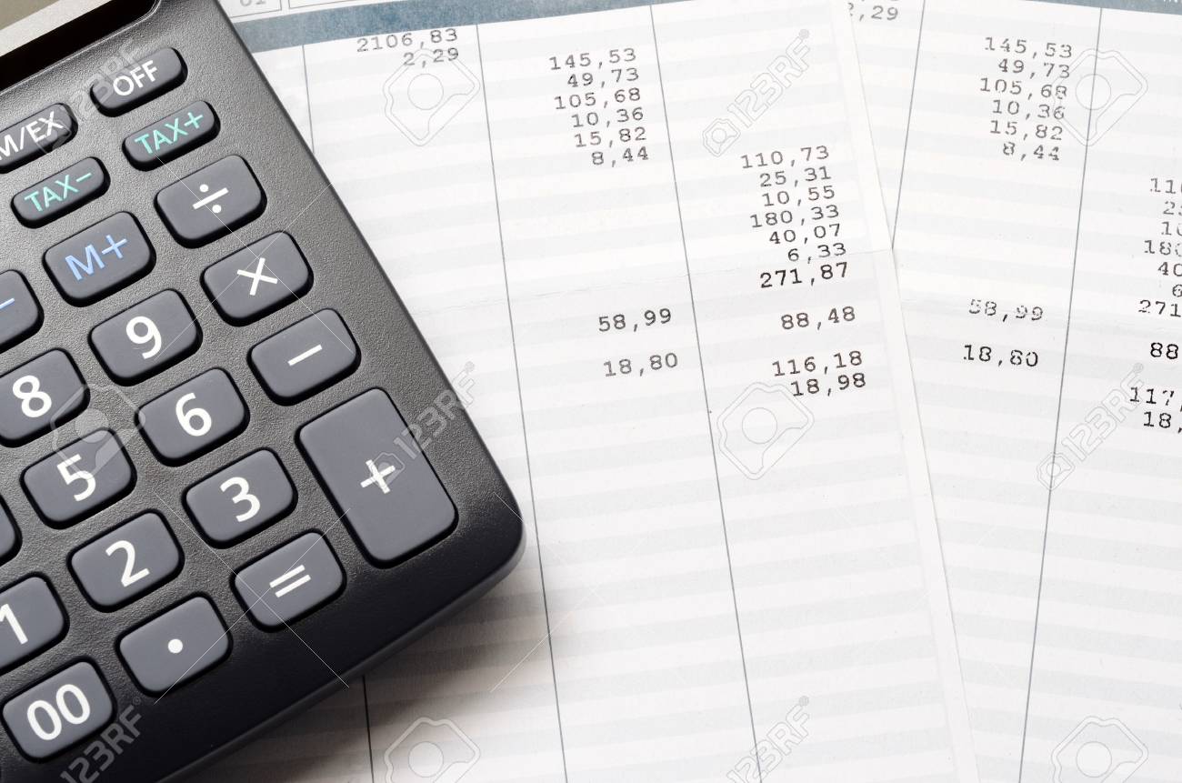 pay slip and calculator close up for payroll or salary background payroll free calculator