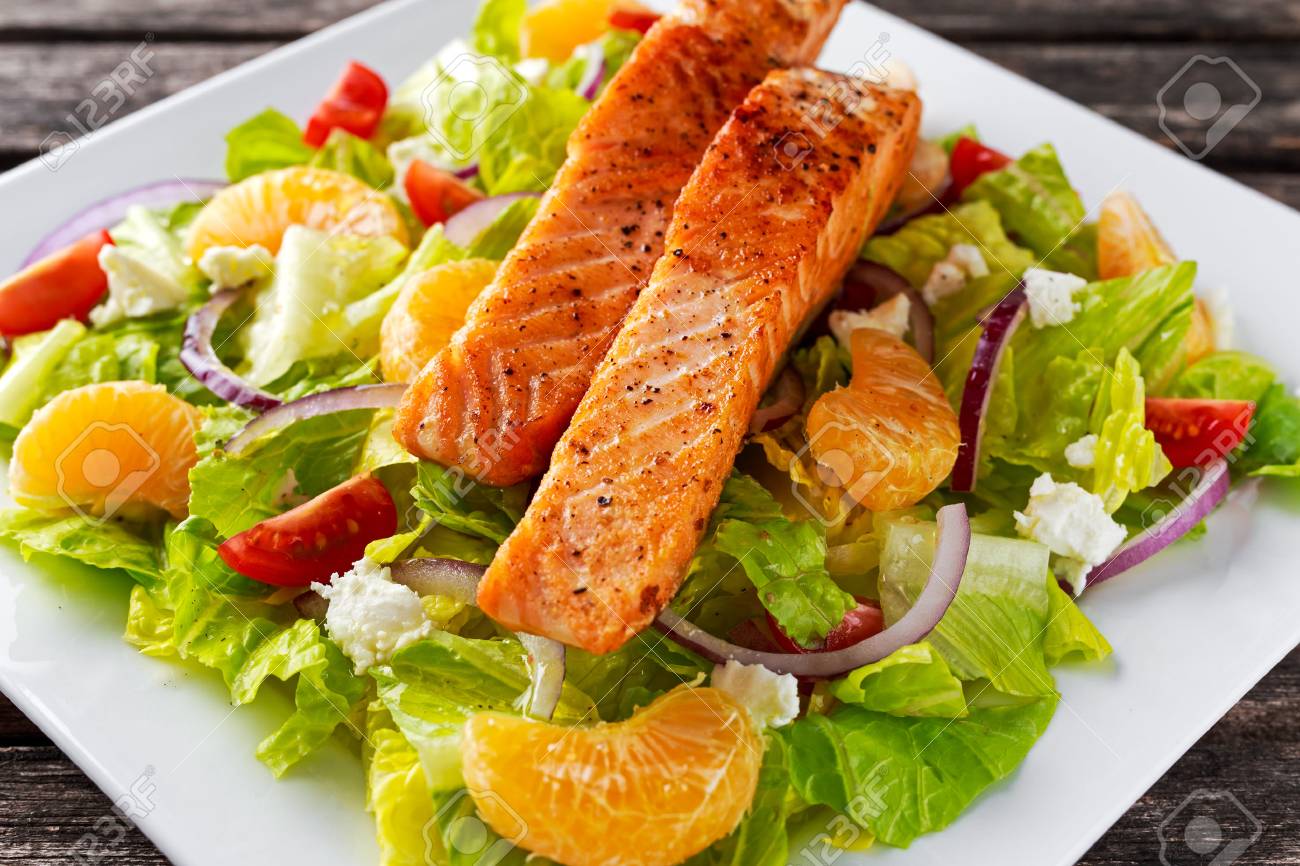 Fresh Orange Salmon salad with honey, tomatoes, onion, mandarin. healthy food concept - 63237957 Fresh Orange Salmon salad with honey, tomatoes, onion, mandarin. healthy food concept - 63237957