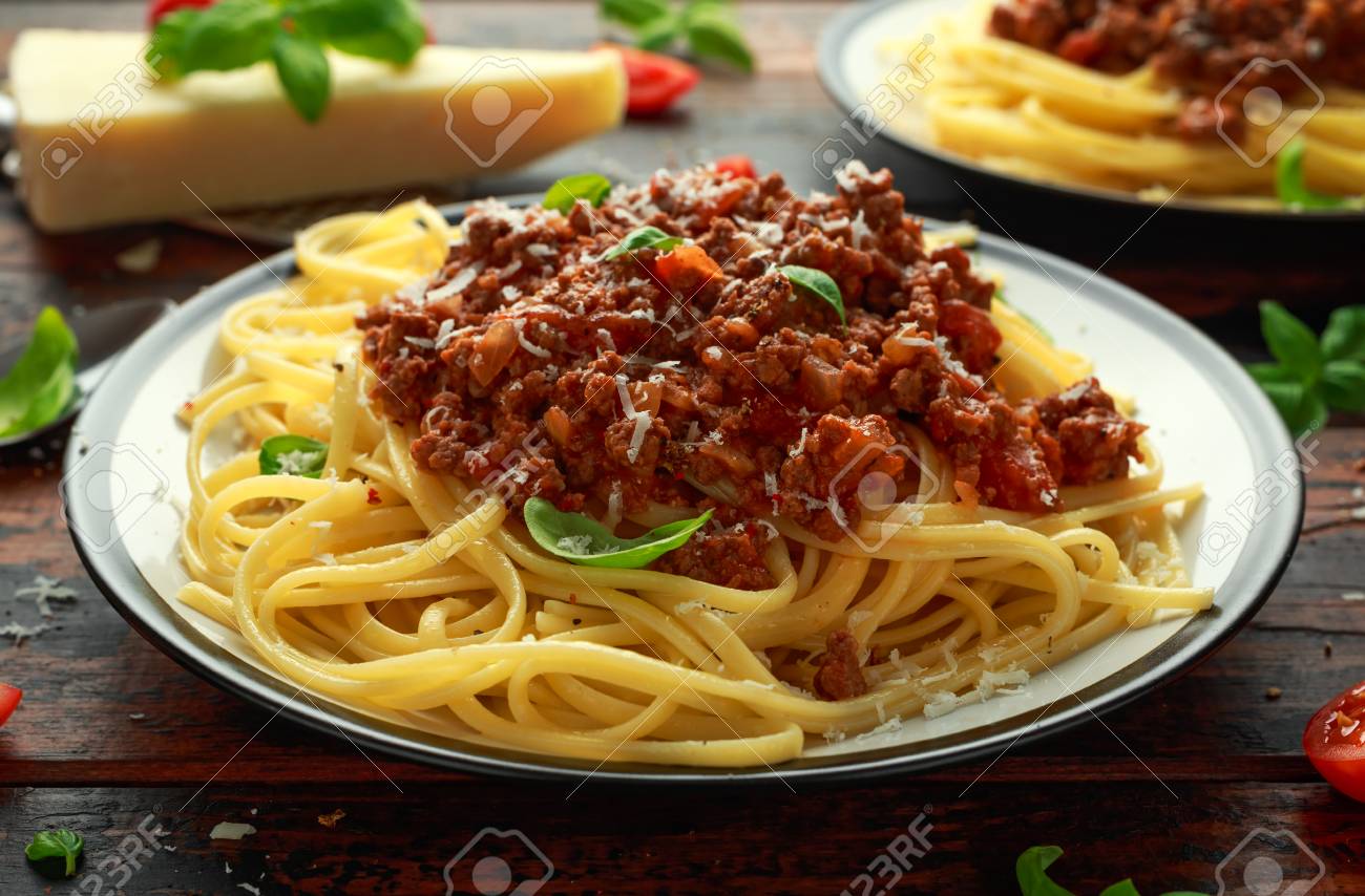 Italian pasta bolognese with beef, basil and parmesan cheese. - 109489712 Italian pasta bolognese with beef, basil and parmesan cheese. - 109489712