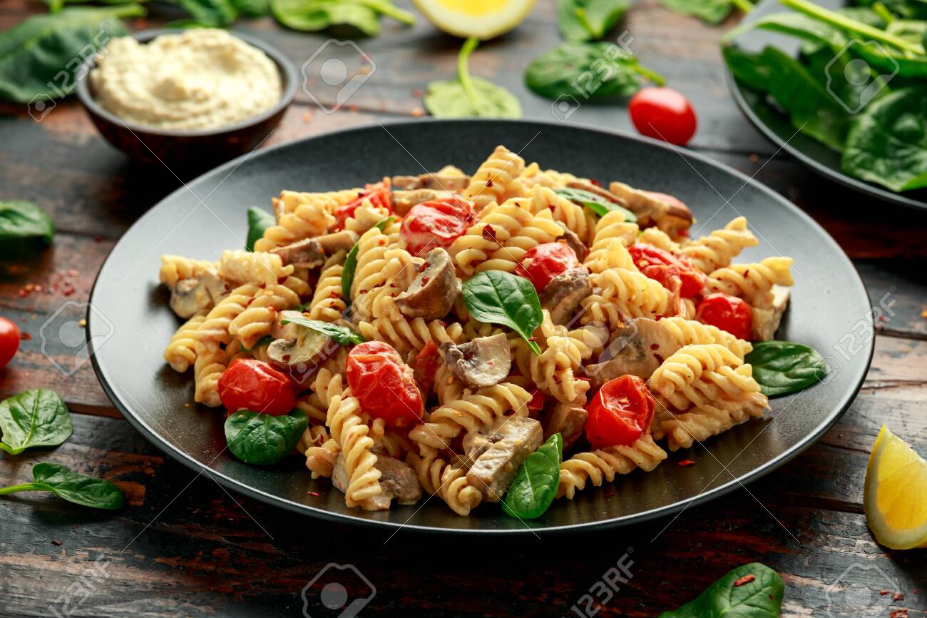 Healthy Creamy Hummus Pasta With Mushroom And Roast Tomatoes Stock Photo Picture And Royalty Free Image Image 141213115