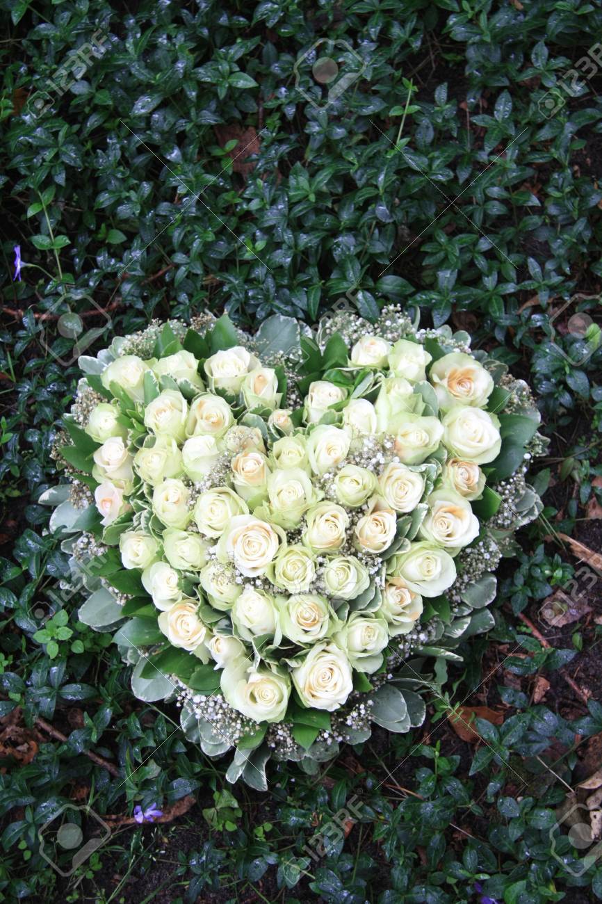 Heart shaped sympathy flower arrangement with white roses - 12072908 Heart shaped sympathy flower arrangement with white roses - 12072908
