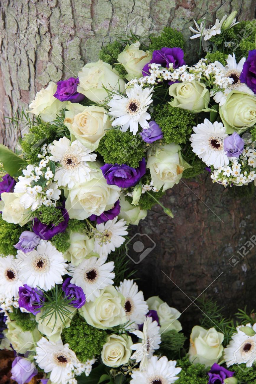 White and purple sympathy flowers in a funeral wreath, detail - 16186981 White and purple sympathy flowers in a funeral wreath, detail - 16186981