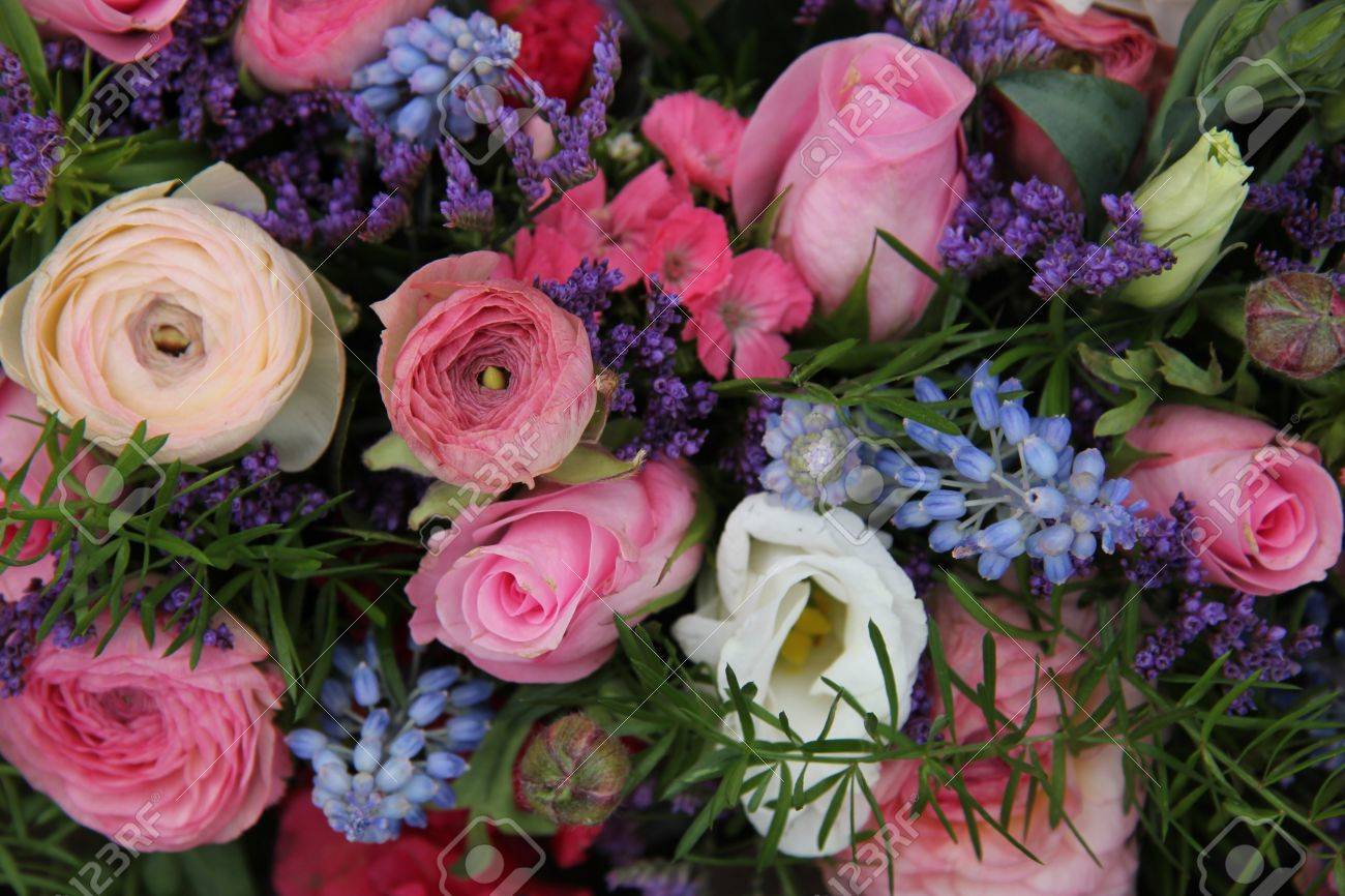Pink Roses And Ranonkels Blue Common Hyacints In A Spring Flower Wedding Centerpiece Stock Photo Pink Roses And Ranonkels Blue Common Hyacints In A Spring Flower Wedding Centerpiece Stock Photo