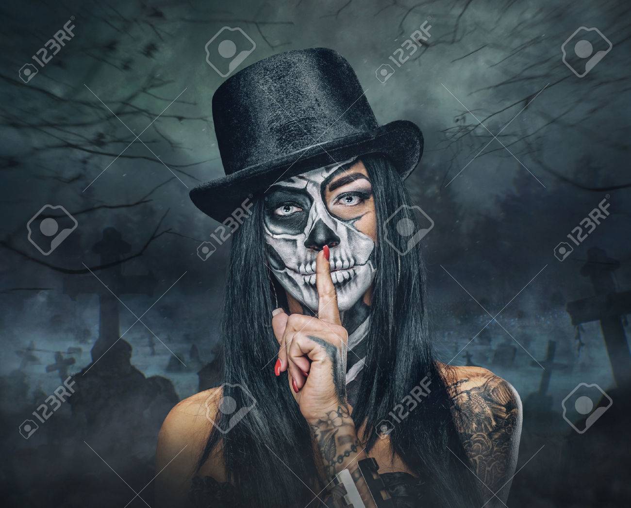 Portrait of female with skull make up in top hat on Halloween. - 65548323 Portrait of female with skull make up in top hat on Halloween. - 65548323