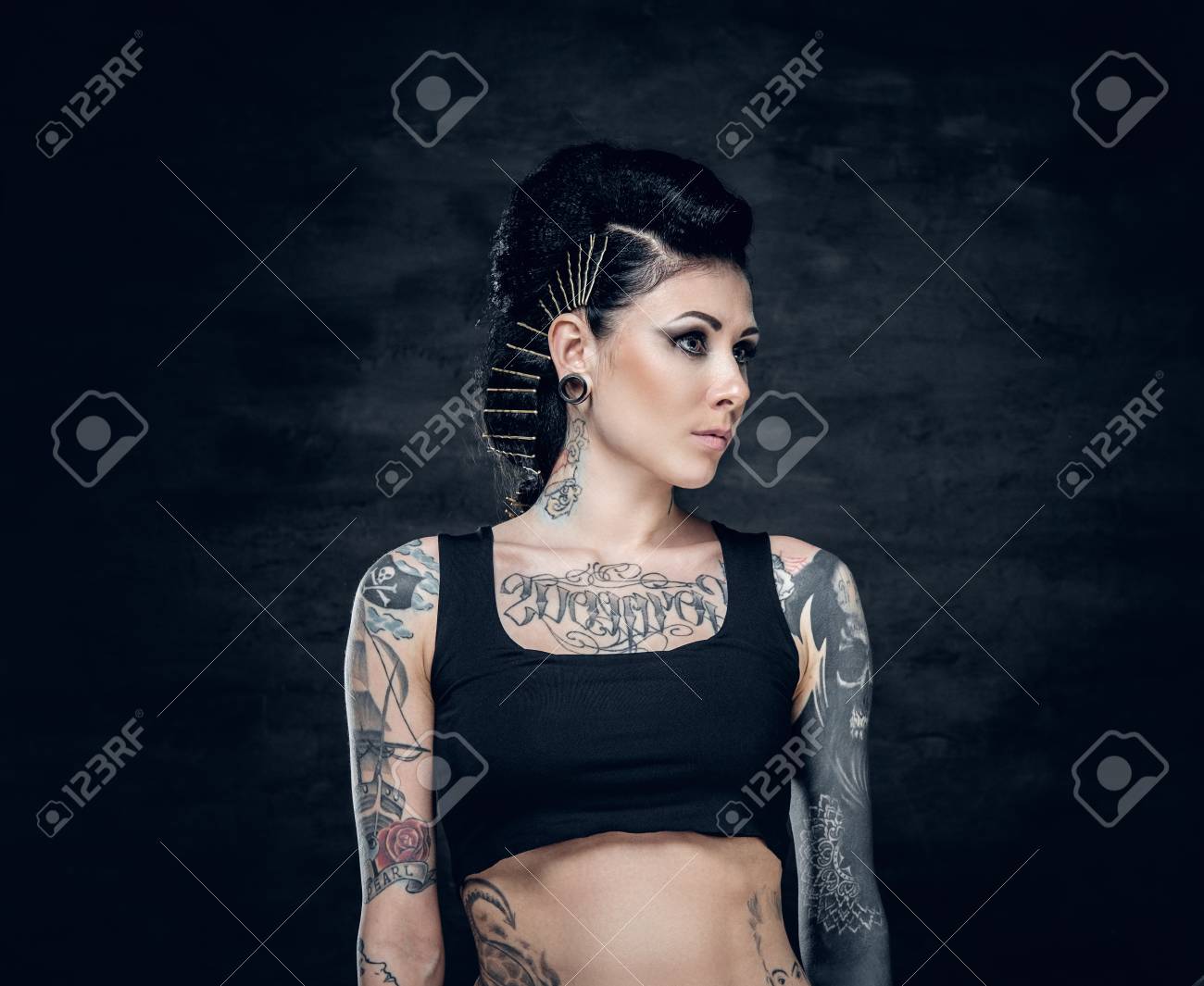 Studio Portrait Of Brunette Female With Tattoo On Her Torso Stock Photo Picture And Royalty Free Image Image