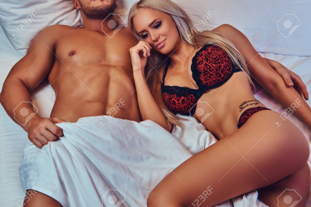 Portrait Of Sexy Husband And Wife, Relaxing In Bed, Honeymoon. Фотография,  картинки, изображения и сток-фотография без роялти. Image 95294828