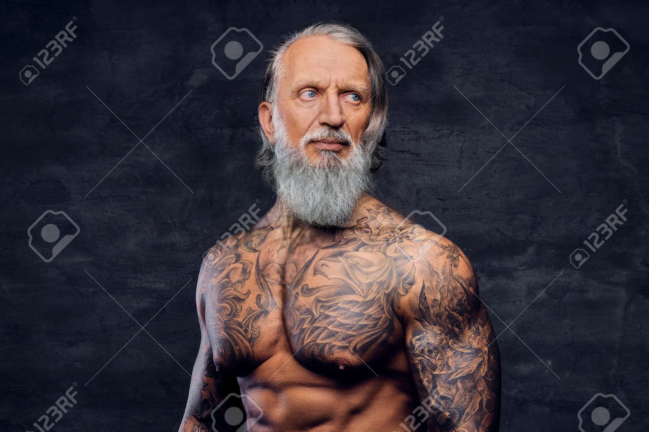 Old Man With Timeless Tattoos Stands Strong