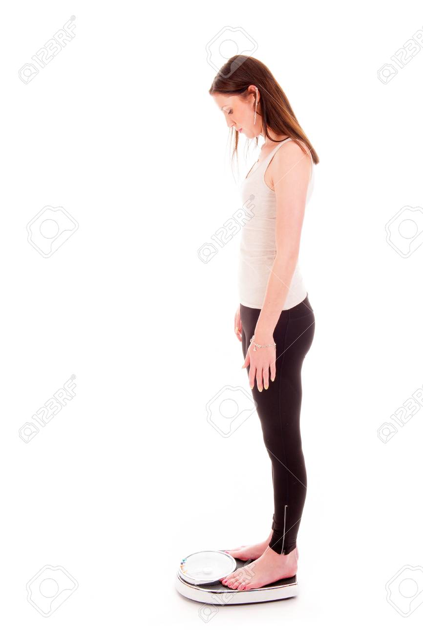 a girl on a weighing scale disappointed of loosing to too little