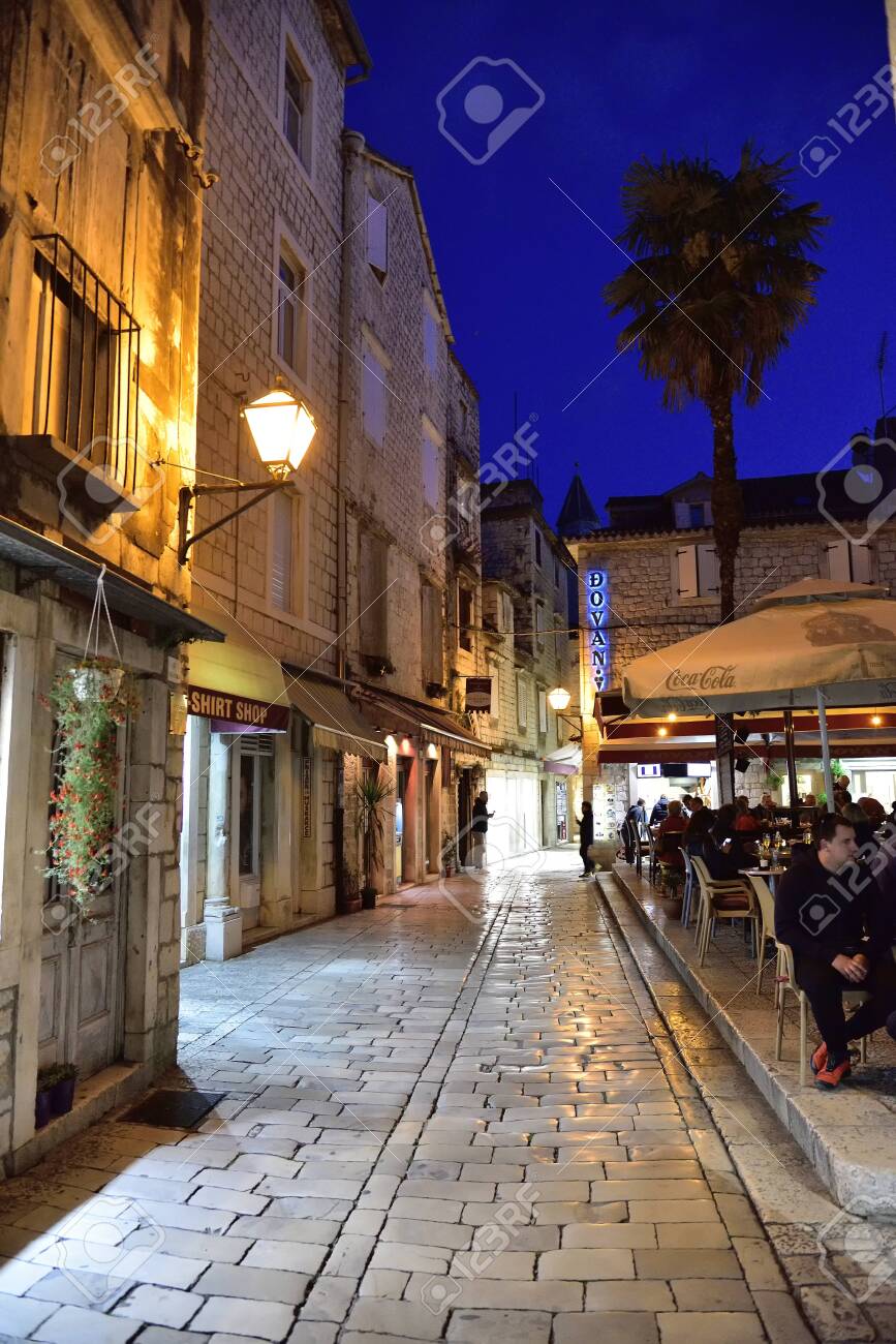 TROGIR, CROATIA - APRIL 31, 2019: Restaurant in narrow streets of mediterranean city. Trogir at night. Croatia.` - 150570789 TROGIR, CROATIA - APRIL 31, 2019: Restaurant in narrow streets of mediterranean city. Trogir at night. Croatia.` - 150570789