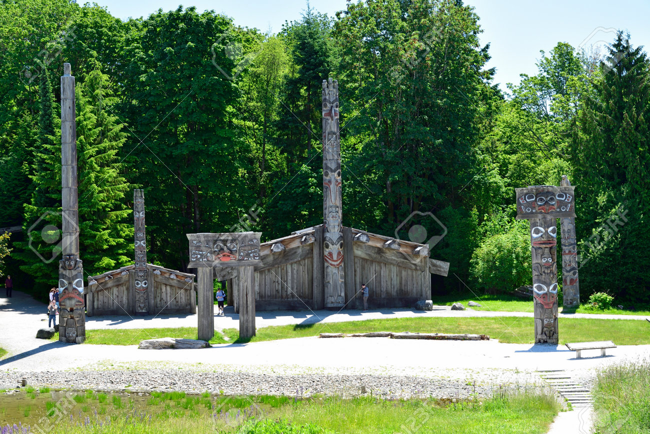 VANCOUVER, BC, CANADA, JUNE 03, 2019: First Nations totem poles and Haida houses in Museum of Anthropology at the University of British Columbia UBC campus in Vancouver - 161070547 VANCOUVER, BC, CANADA, JUNE 03, 2019: First Nations totem poles and Haida houses in Museum of Anthropology at the University of British Columbia UBC campus in Vancouver - 161070547