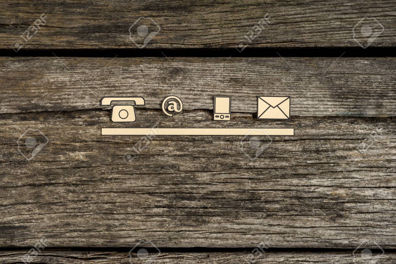 Contact and communication icons, telephone, at sign, mobile and mail, on textured rustic wooden boards. - 86581916 Contact and communication icons, telephone, at sign, mobile and mail, on textured rustic wooden boards. - 86581916