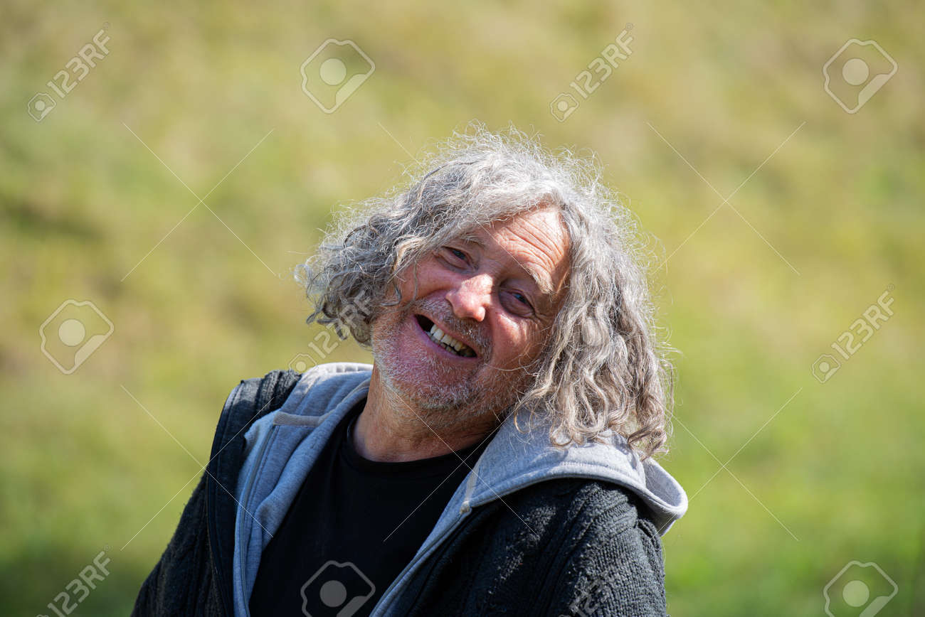 Portrait of a cheerful senior homeless man with a bright smile. - 169239405 Portrait of a cheerful senior homeless man with a bright smile. - 169239405
