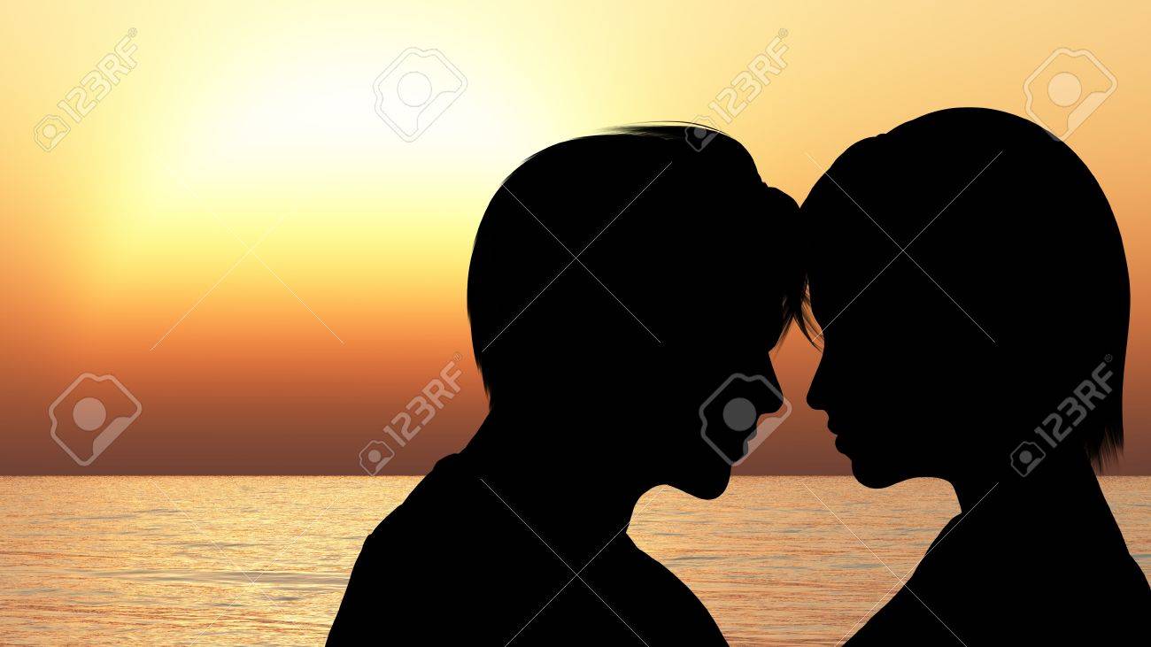silhouette kissing a loving couple against sunset stock photo 12240803
