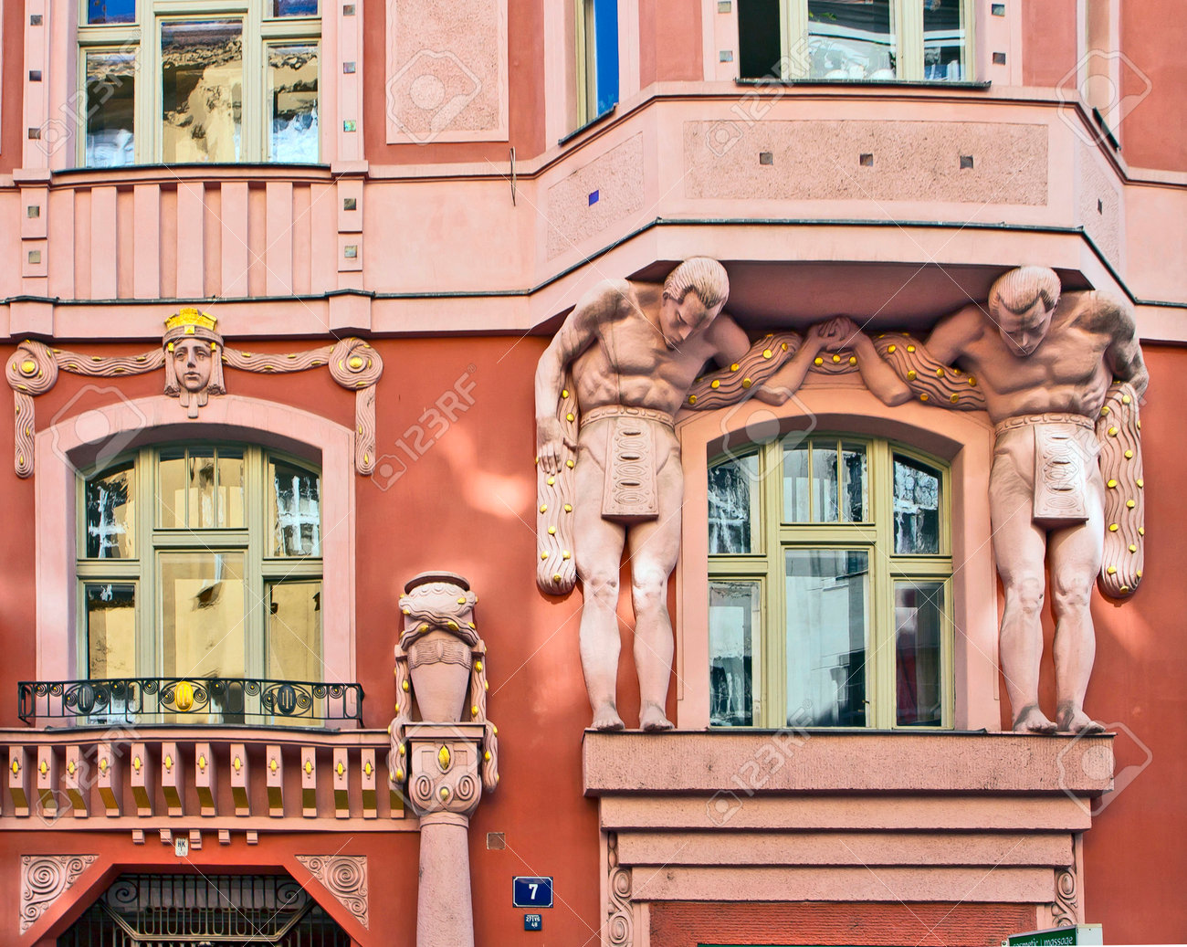 Art nouveau palace in Prague center, detail of figures and ..