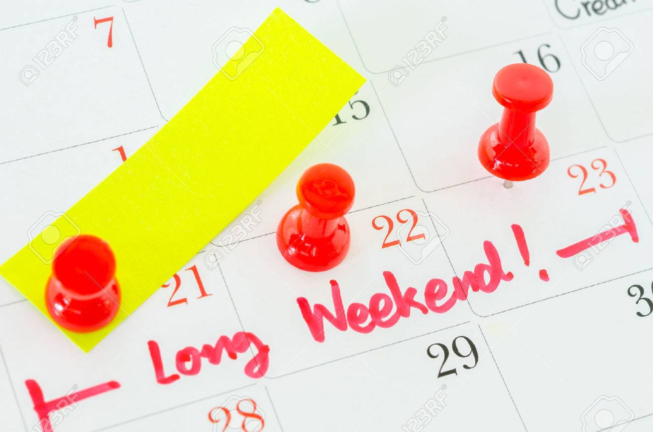 Concept image of a Calendar with a red push pin. Closeup shot of a thumbtack attached. The words Long Weekend written on a white calendar to remind you an important appointment. - 48174645 Concept image of a Calendar with a red push pin. Closeup shot of a thumbtack attached. The words Long Weekend written on a white calendar to remind you an important appointment. - 48174645