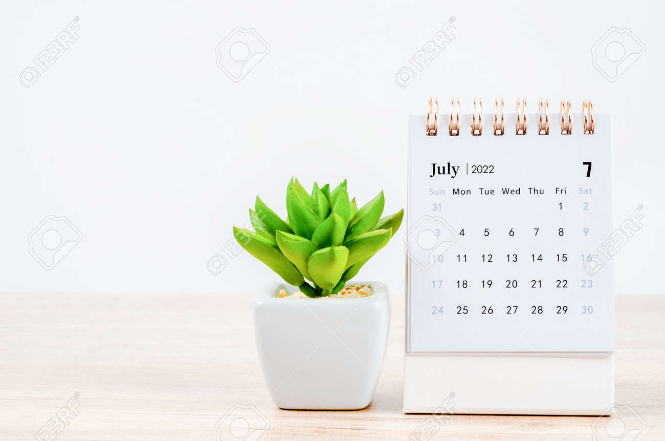 July 2022 Desktop Calendar The July 2022 Desk Calendar On Wooden Table. Stock Photo, Picture And  Royalty Free Image. Image 177178691.