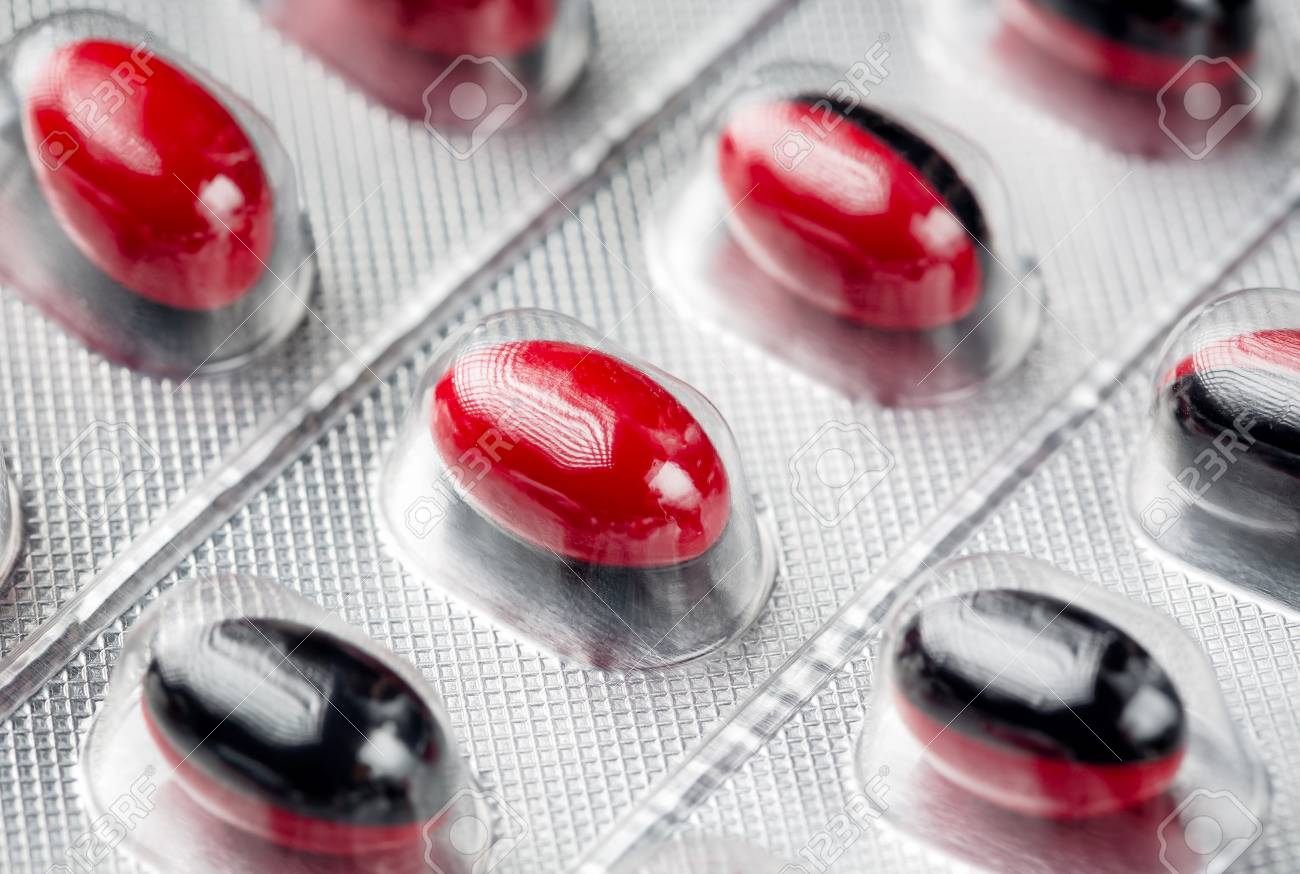 Red And Black Color Capsules Pills Extreme Close Up As A Background Stock Photo Picture And Royalty Free Image Image 81590906