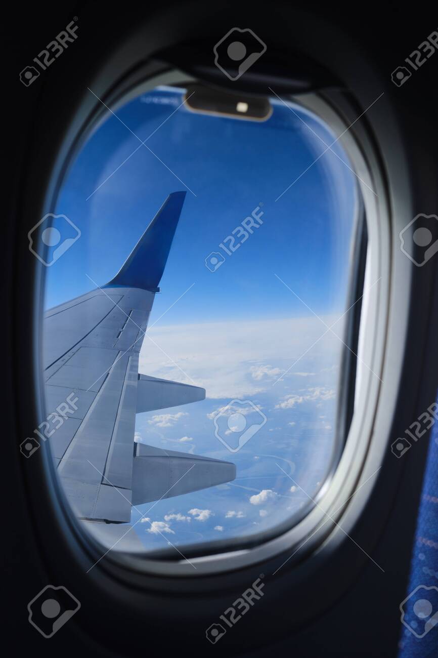 Airplane Window View On The Clouds And Blue Sky Horizon Plane Stock Photo Picture And Royalty Free Image Image 147408884