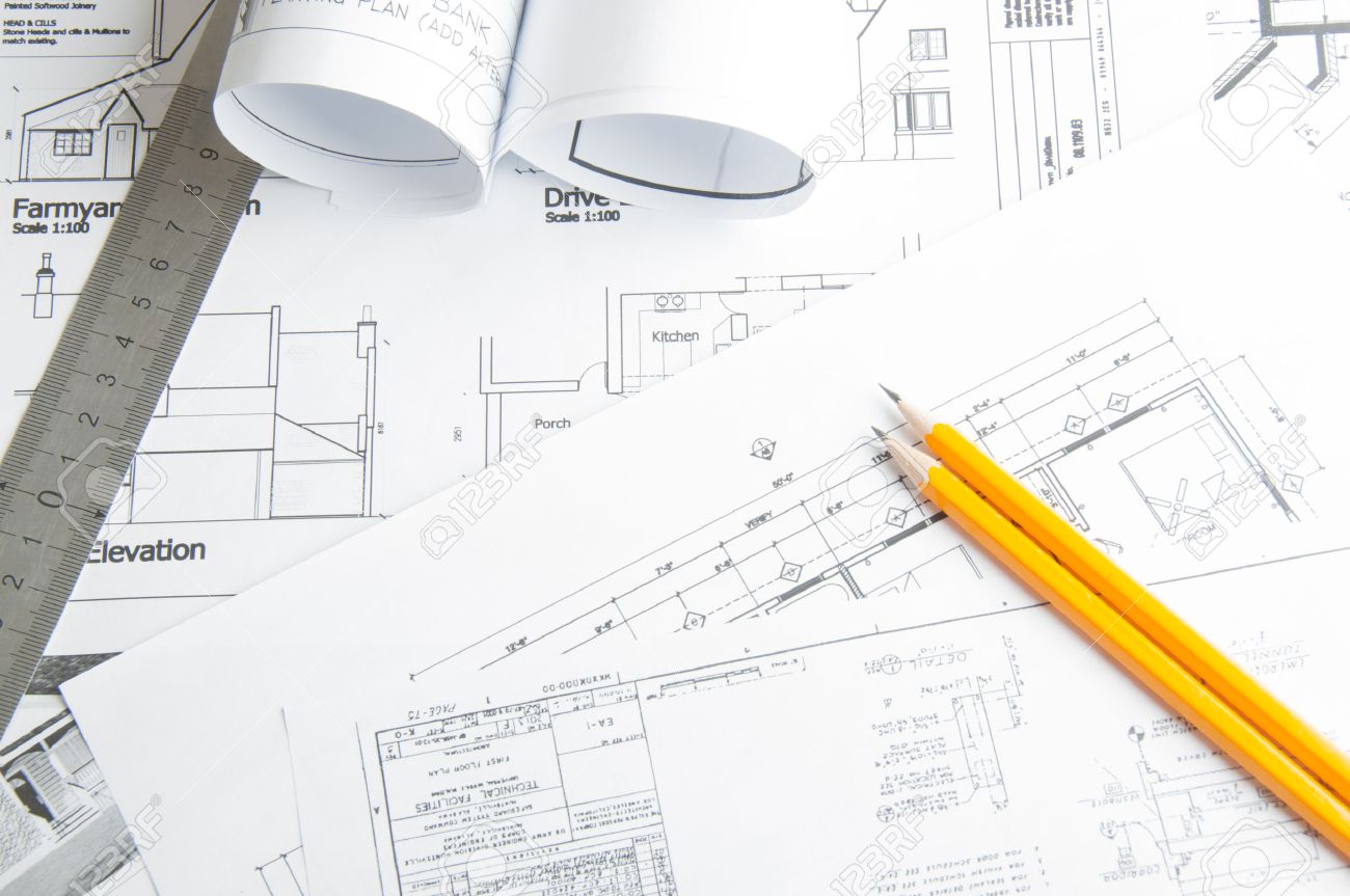 Construction planning drawings on the table and two yellow pencils - 35295502 Construction planning drawings on the table and two yellow pencils - 35295502