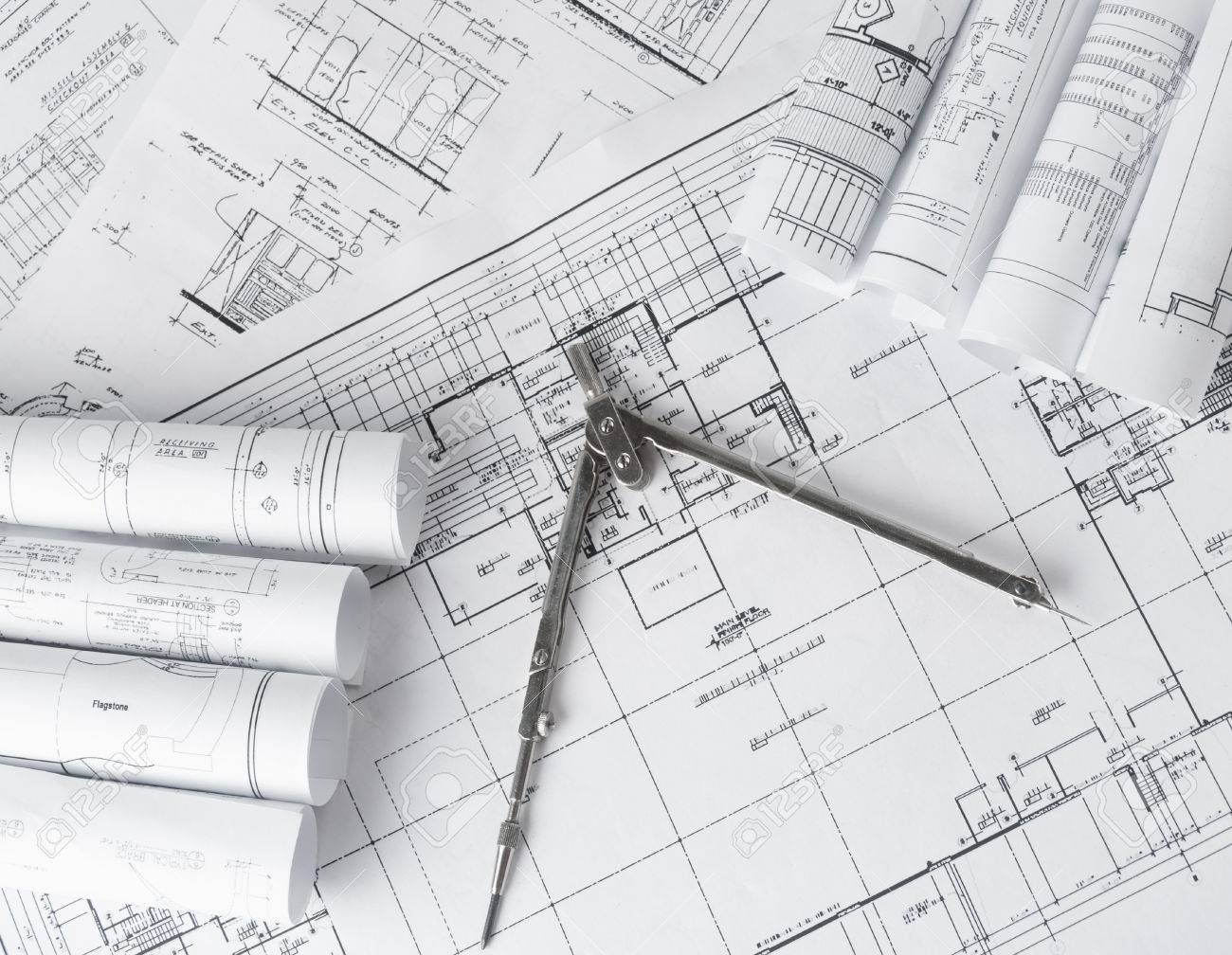 architecture blueprints ancient rolls of architecture blueprints and house plans on the table drawing compass stock photo rolls of architecture blueprints and house plans on the table architecture blueprints ancient rolls of architecture blueprints and house plans on the table drawing compass stock photo rolls of architecture blueprints and house plans on the table