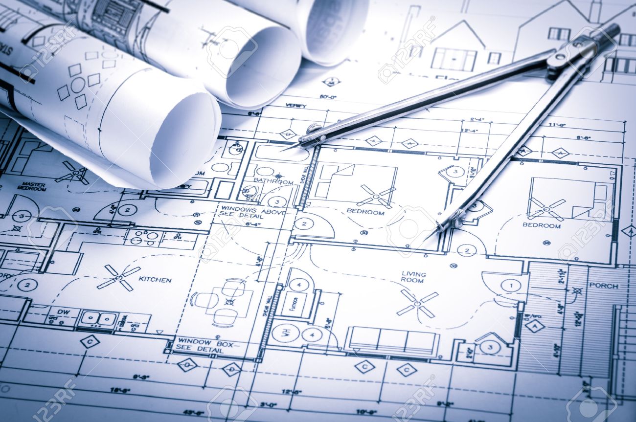 Architecture Blueprints rolls of architecture blueprints and house plans on the table Architecture Blueprints rolls of architecture blueprints and house plans on the table