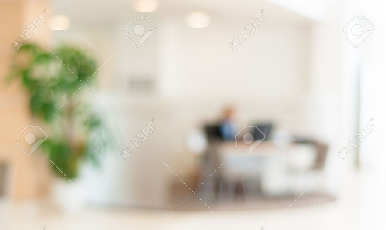 blurred office background office worker at the computer working blurred office background