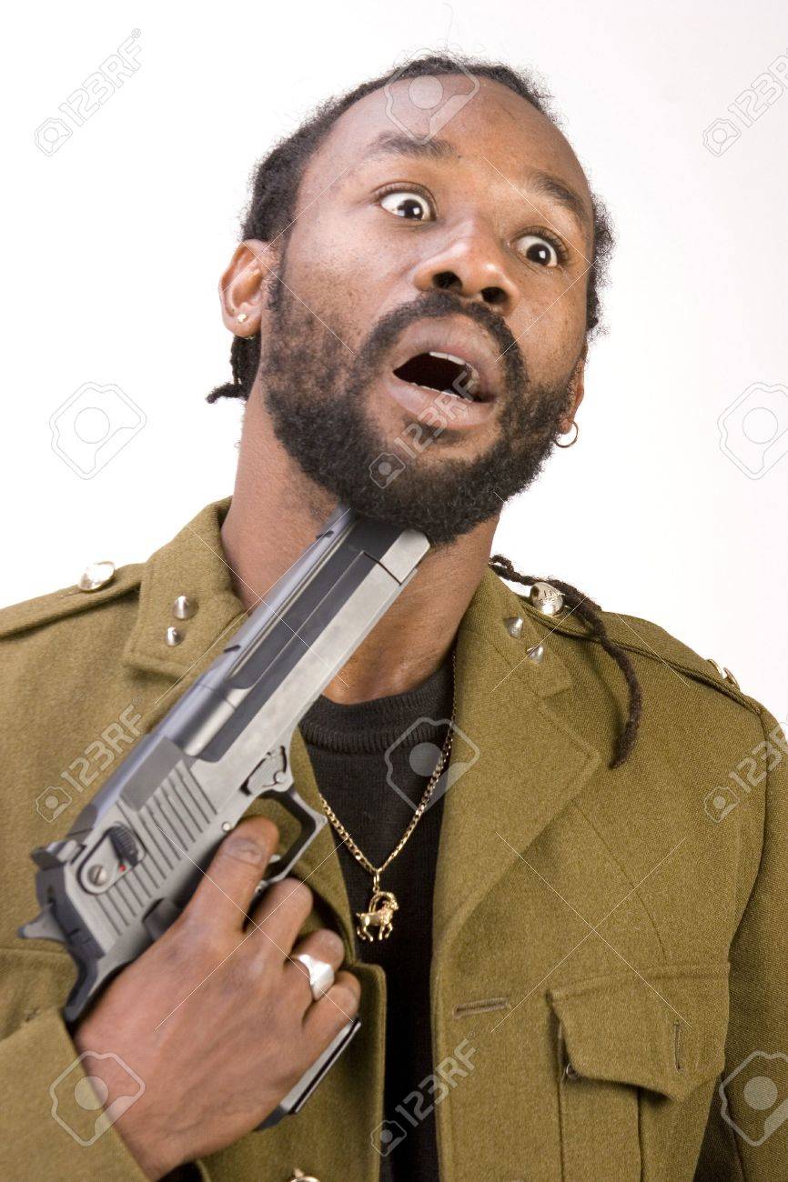 A Black Man In A Army Jacket With A Gun Isolated On A White Background.  Фотография, картинки, изображения и сток-фотография без роялти. Image  2346710