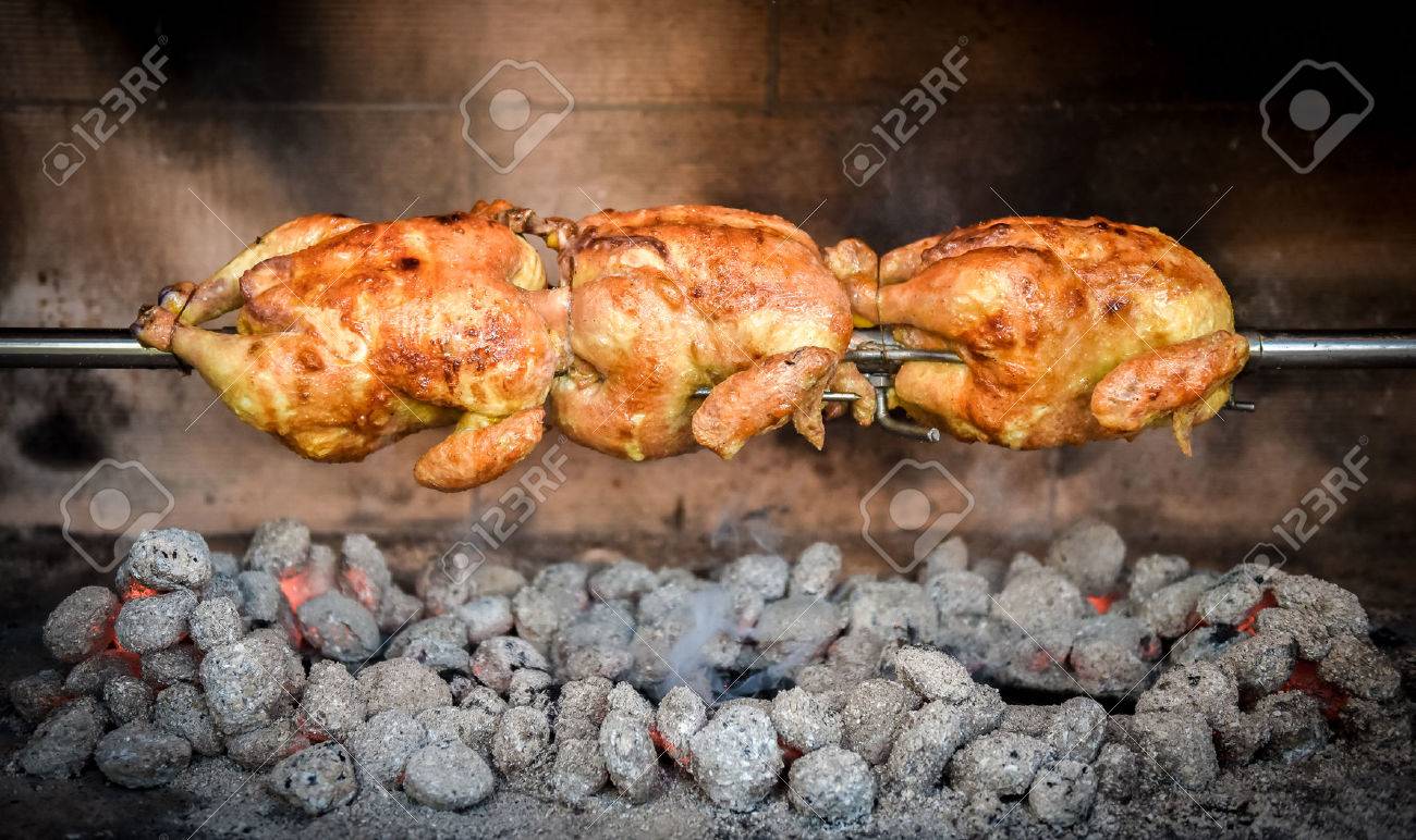 Cooking 3 Rotisserie Chicken On The Grill With Charcoal And Briquettes Stock Photo Picture And Royalty Free Image Image 47547425