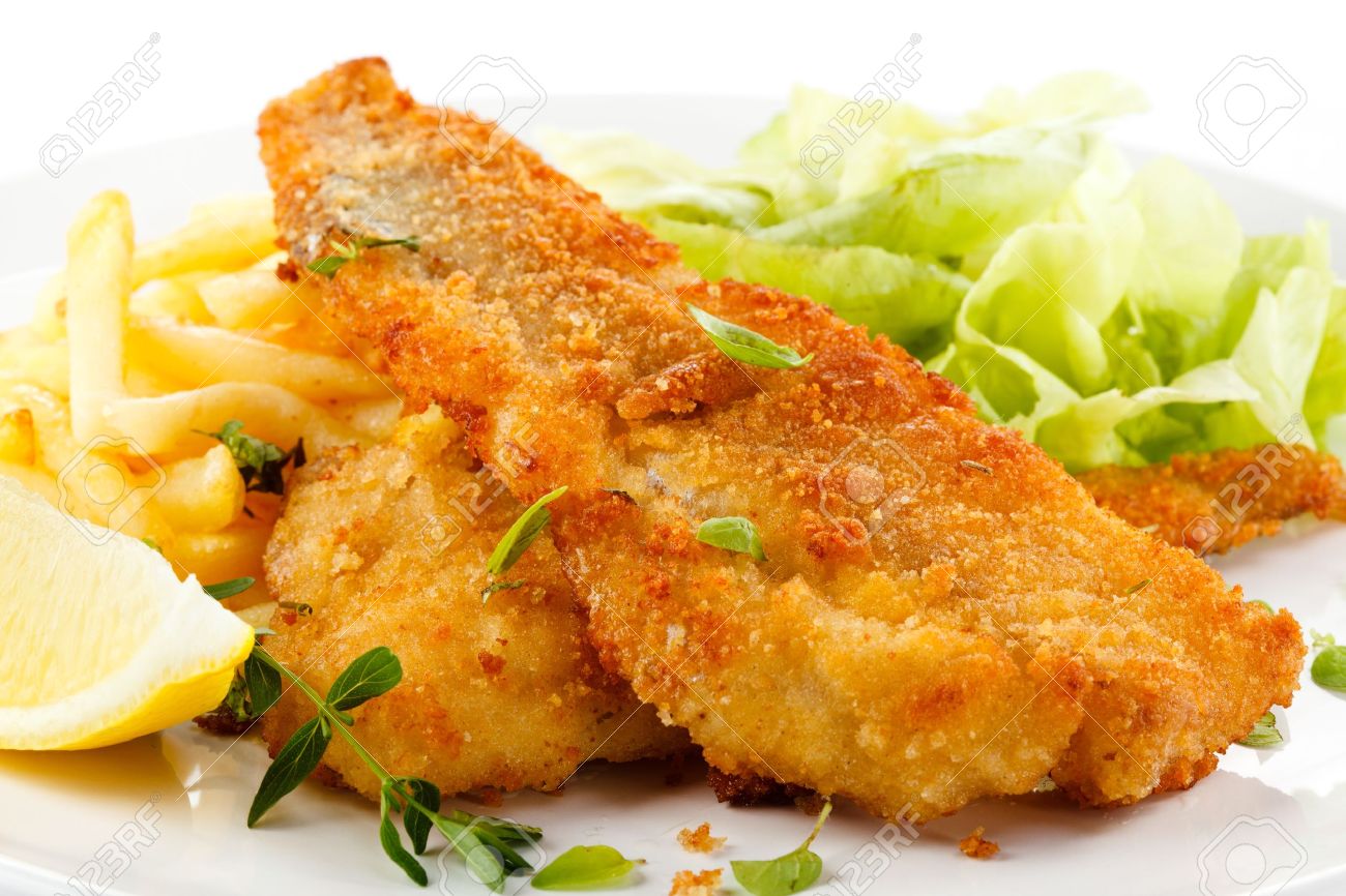 Fish dish - fried fish fillet, French fries with vegetables - 16050676 Fish dish - fried fish fillet, French fries with vegetables - 16050676