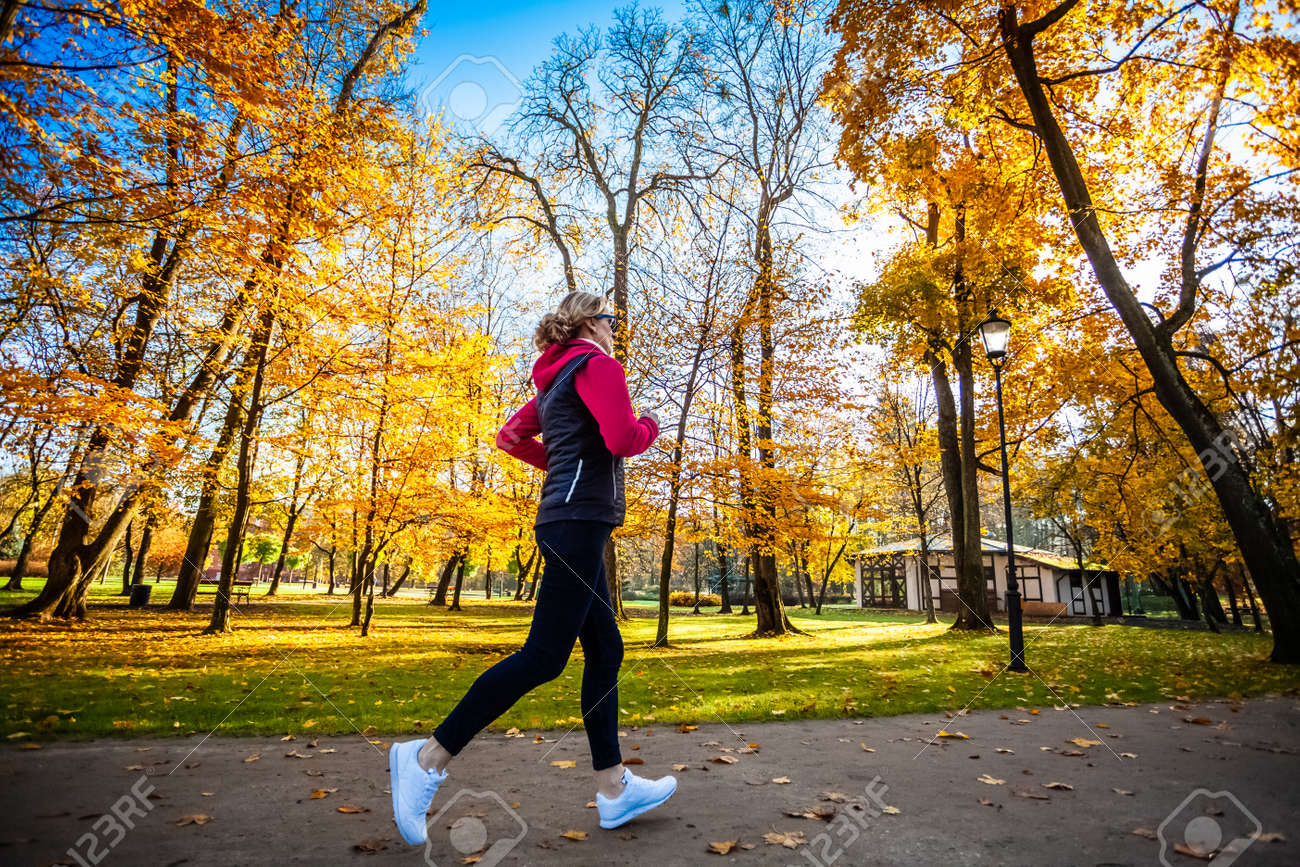 Healthy lifestyle - woman running in city park - 147993949 Healthy lifestyle - woman running in city park - 147993949