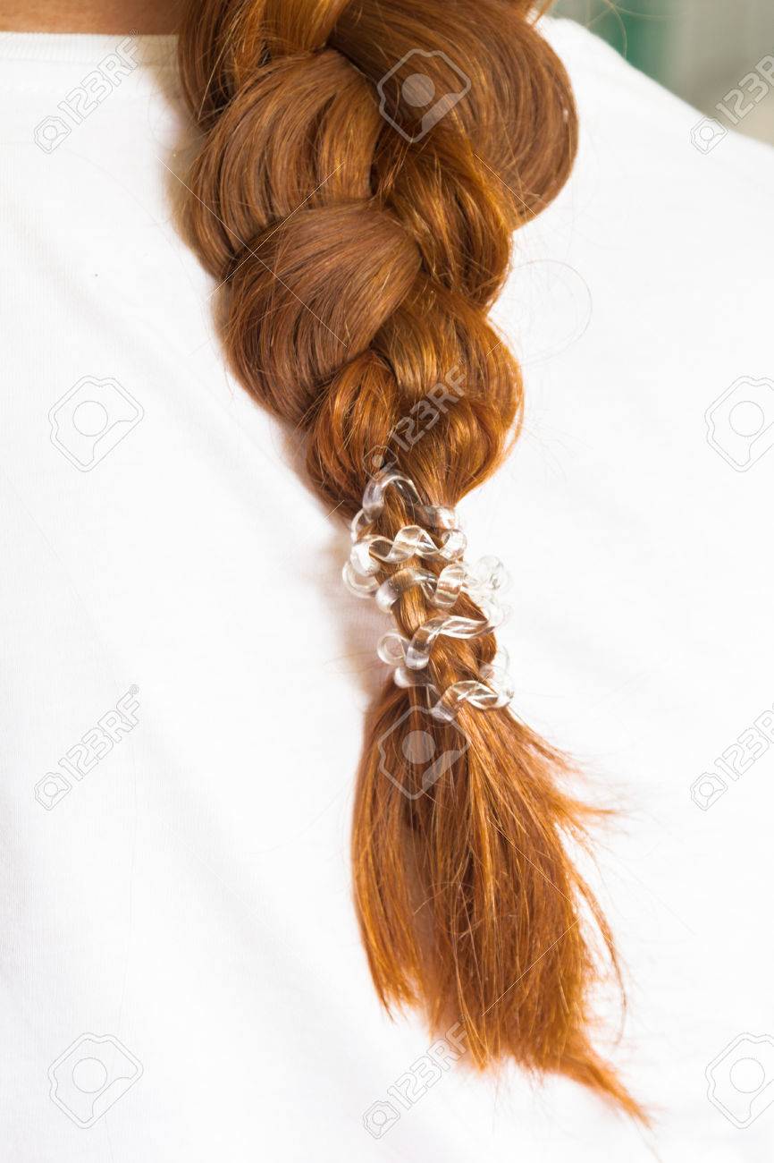 Girly Red Hair Braided Into A Braid With A Ponytail