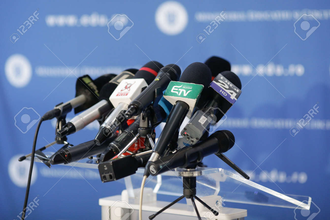 Bucharest, Romania - March 23, 2021: Shallow depth of field (selective focus) image with microphones from various Romanian news televisions before a press conference. - 166476117 Bucharest, Romania - March 23, 2021: Shallow depth of field (selective focus) image with microphones from various Romanian news televisions before a press conference. - 166476117