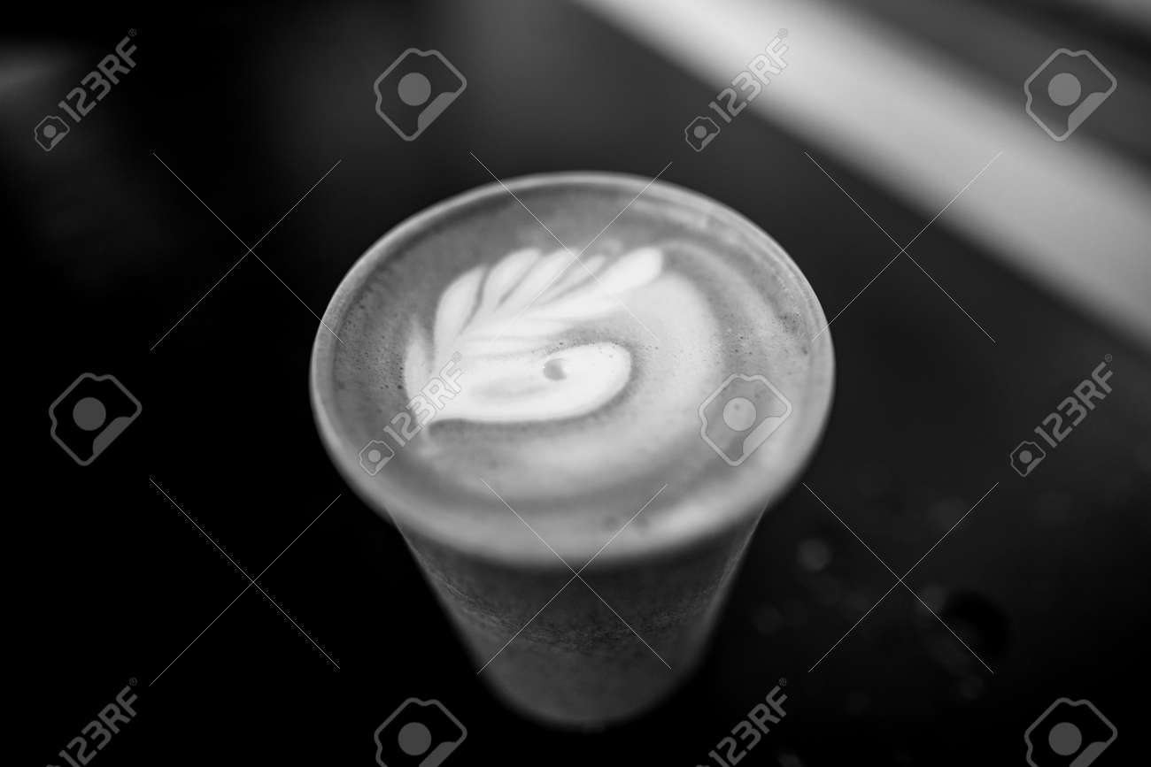 Shallow depth of field (selective focus) image with details of a decorated coffee in a paper cup. - 167266237 Shallow depth of field (selective focus) image with details of a decorated coffee in a paper cup. - 167266237