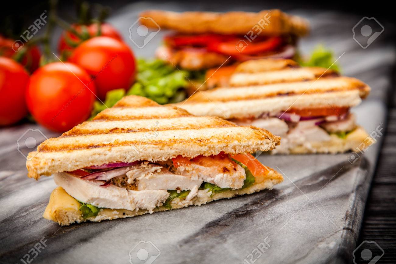 Grilled Chicken Sandwich With Yellow Cheese And Vegetables Stock Photo Picture And Royalty Free Image Image 58394891