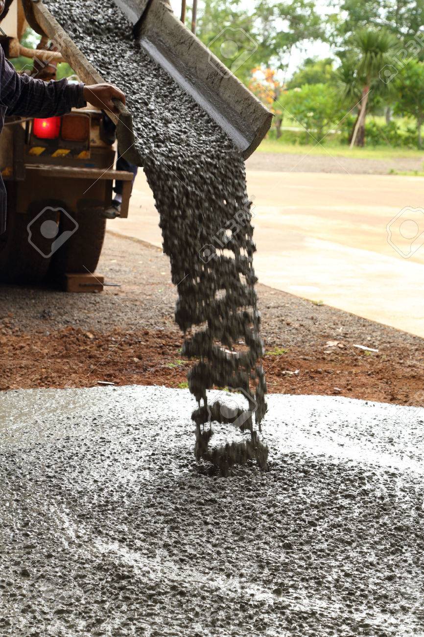 Pouring cement during sidewalk upgrade - 30139326 Pouring cement during sidewalk upgrade - 30139326