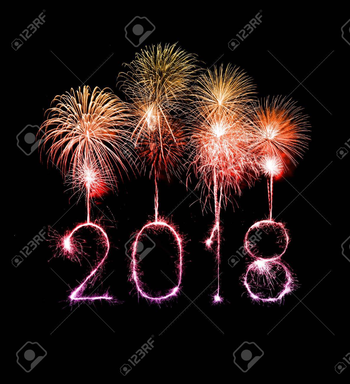 Happy new year 2018 written with Sparkle firework at night - 87099033 Happy new year 2018 written with Sparkle firework at night - 87099033