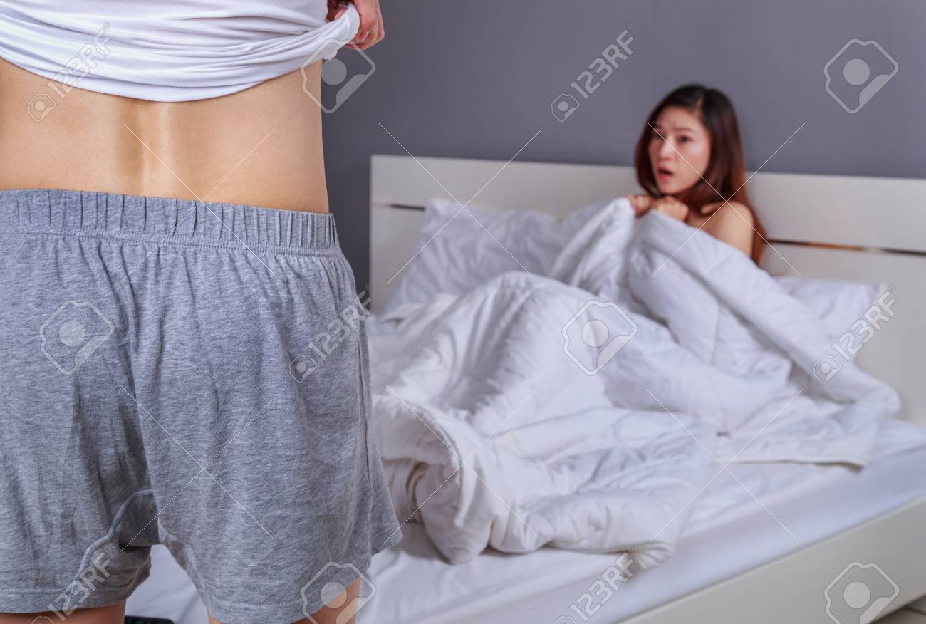 Man taking womans clothes off