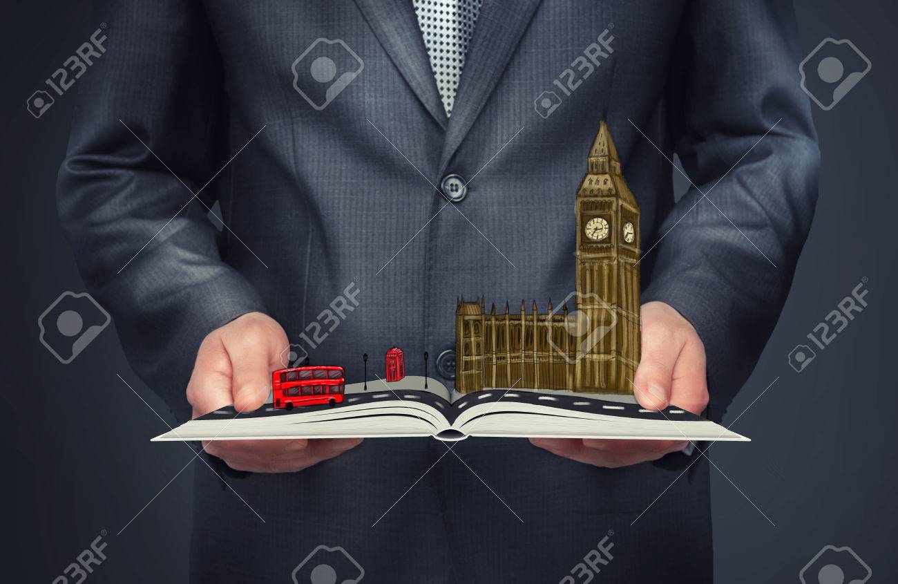 A Businessman Holding An Open Book With A Sketch Of London On