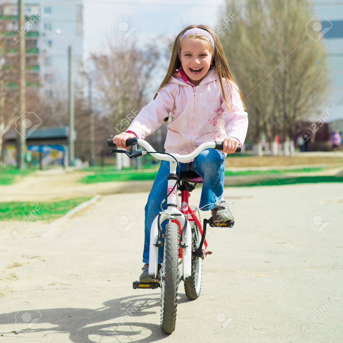 Image: https://previews.123rf.com/images/gekaskr/gekaskr1305/gekaskr130500172/19943508-Little-girl-on-a-bicycle-in-summer-park-Stock-Photo-girl-bike.jpg