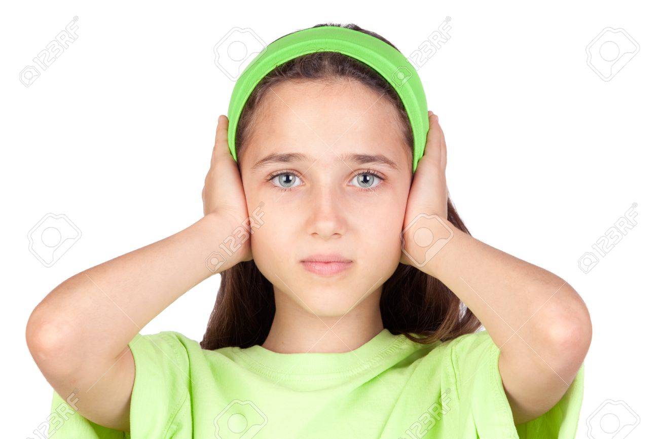 Frightened girl with ears plugged isolated on a white background - 7363443 Frightened girl with ears plugged isolated on a white background - 7363443