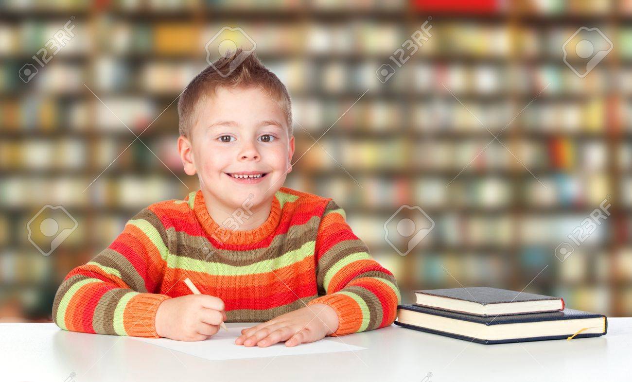 schooler Elementary Schooler Doing Homework In The Library Stock Photo, Picture and  Royalty Free Image. Image 18242579.