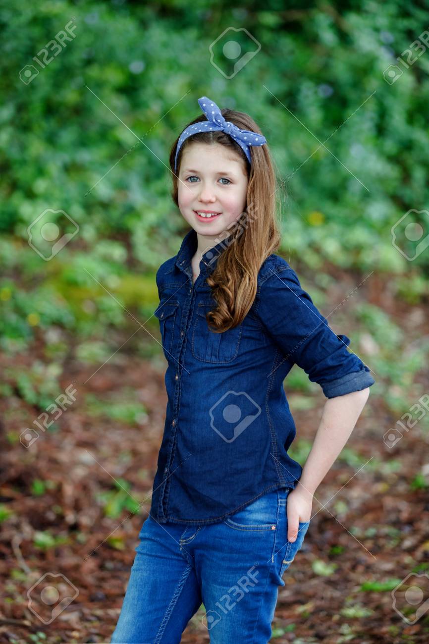 Beautiful Girl With Ten Years Old Wearing A Blue Hair Scarf Enjoying Stock Photo Picture And Royalty Free Image Image 104068036