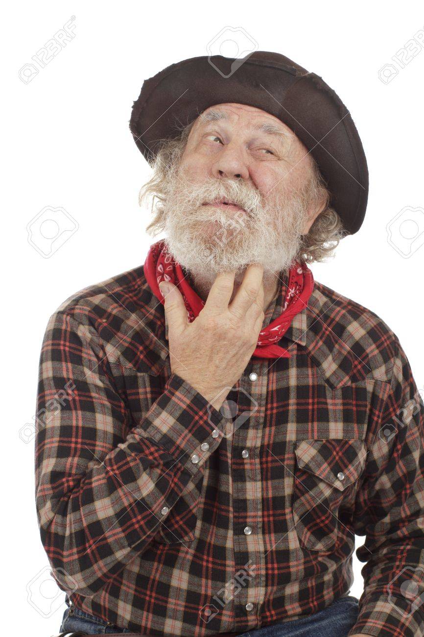 Old West Cowboy With Battered Felt Hat Looks Sideways And Scratches Stock  Photo Picture And Royalty Free Image Image 16980090