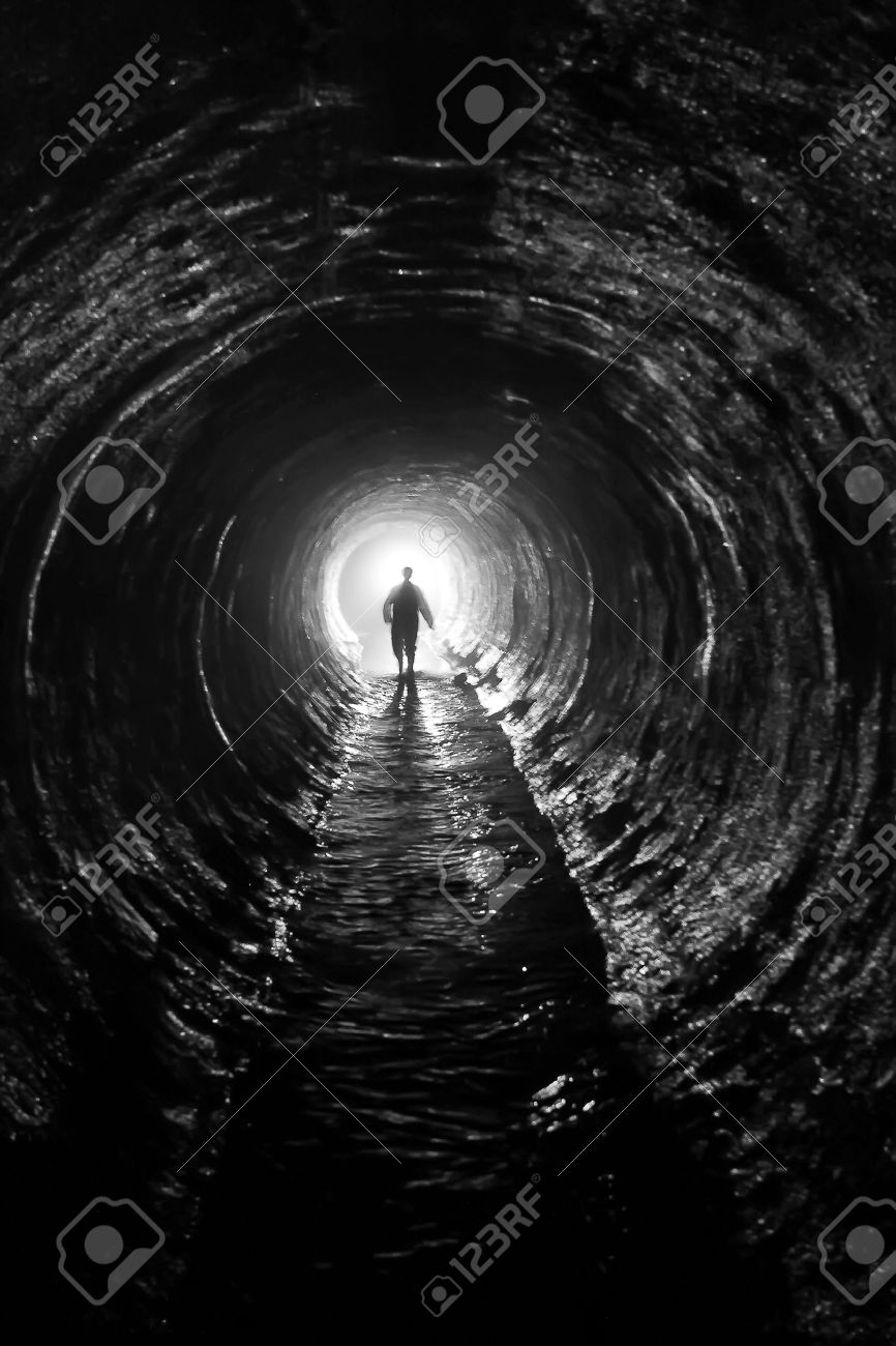 silhouette in a communication tunnel Light at End of Tunnel - 14459776 silhouette in a communication tunnel Light at End of Tunnel - 14459776